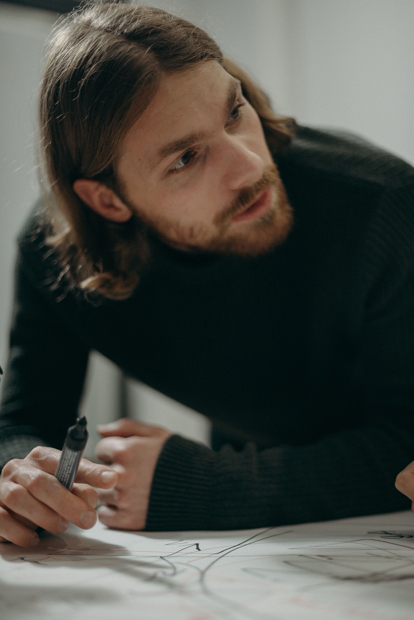 An engineer sketching the route on paper